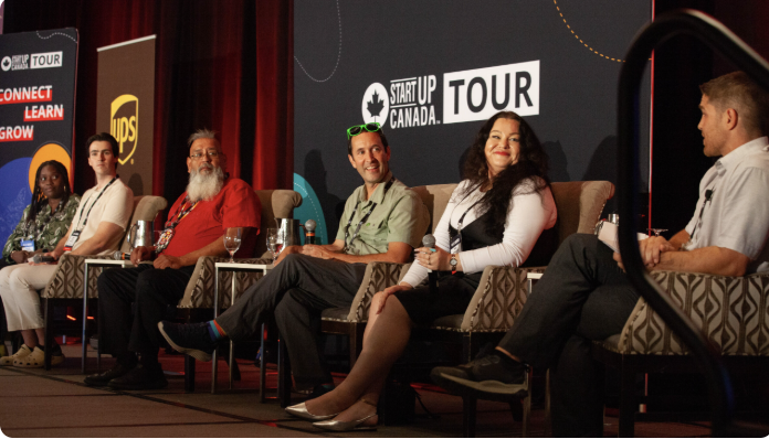 Startup Canada Tour panel with speakers on stage.