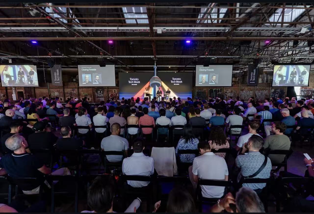 Audience attending a technology conference session.